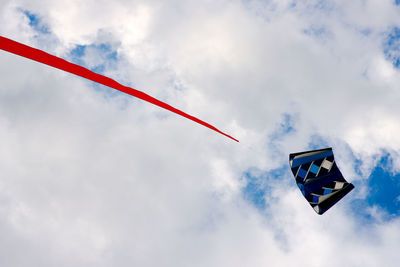 Low angle view of flags against sky