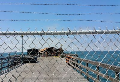 Chainlink fence against clear sky