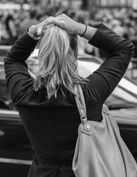 Rear view of woman with umbrella