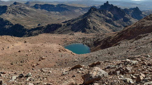 Volcanic craters and small lakes above the clouds at mount kenya