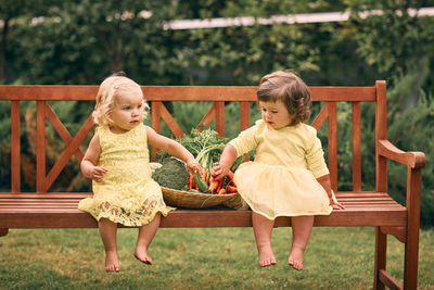 Cute girls sitting outdoors