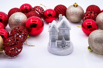 Close-up of christmas decorations on white background