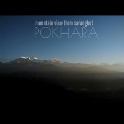 Scenic view of mountains against blue sky