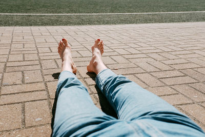 Low section of men sitting outdoors