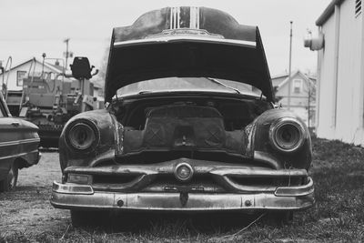 Close-up of car against sky