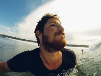 Portrait of young man in water