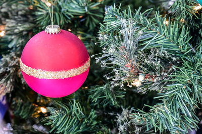 Christmas ornaments hanging from the tree