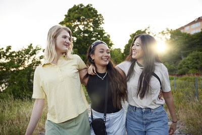 Happy female friends spending time together outdoors