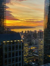 High angle view of buildings against sky during sunset