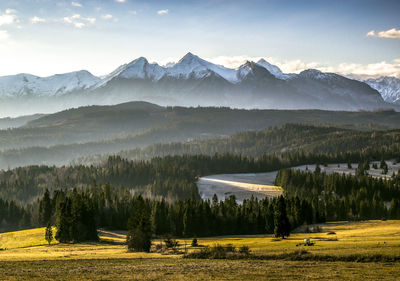 Scenic view of snowcapped mountains against sky