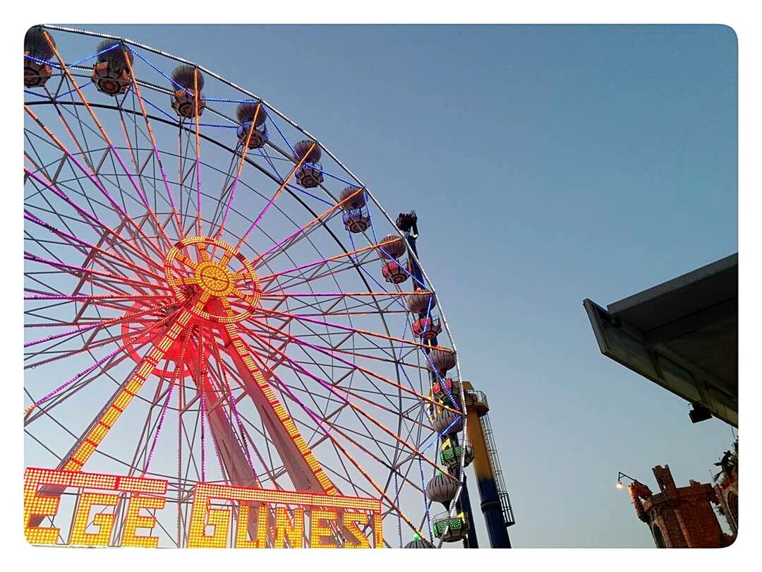 amusement park ride, amusement park, sky, ferris wheel, arts culture and entertainment, low angle view, clear sky, leisure activity, nature, fairground, day, fun, no people, outdoors, large, carnival, architecture, enjoyment, auto post production filter, built structure