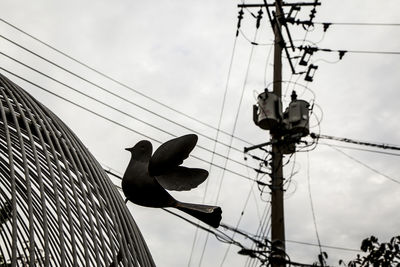 Low angle view of electricity pylon