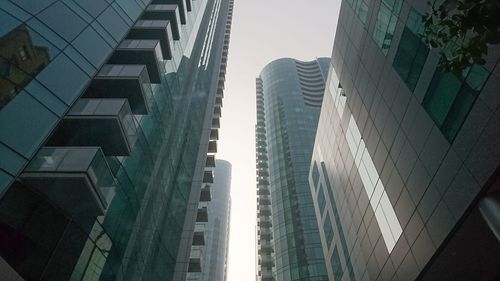 Low angle view of modern buildings against sky