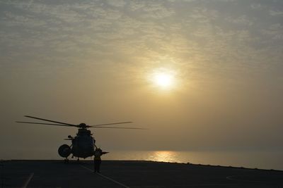 Helicopter against sunset