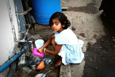 Girl sitting outdoors