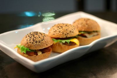 Hamburgers in plate on table