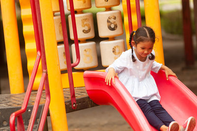 Girl on slide at playground
