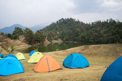 Scenic view of tent on mountain against sky