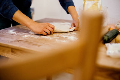 Midsection of person preparing food