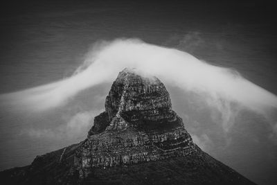 Clouds rolling over table mountain in cape town, southafica. this fenomenon is called tablecloth.