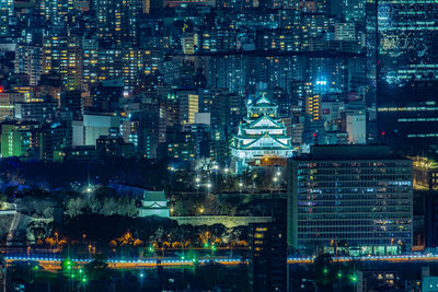 Illuminated buildings in city at night