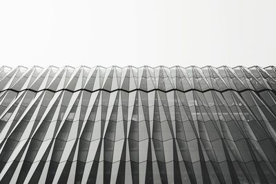 Low angle view of roof and building against clear sky