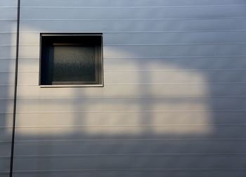 Low angle view of window on wall of building