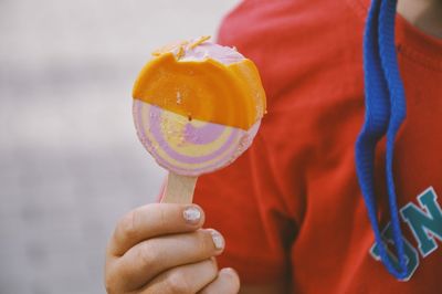 Close-up of hand holding ice cream cone