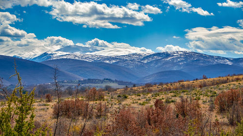 Scenic view of snowcapped mountains against sky