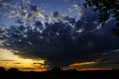 Low angle view of dramatic sky during sunset