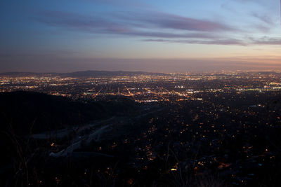 High angle view of illuminated city buildings at night