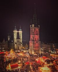 Illuminated buildings in city at night