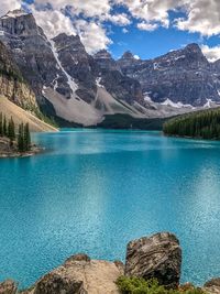 Scenic view of lake and mountains against sky