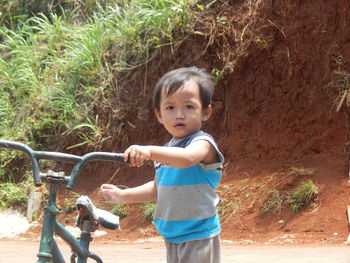 Little boy playing bicycle