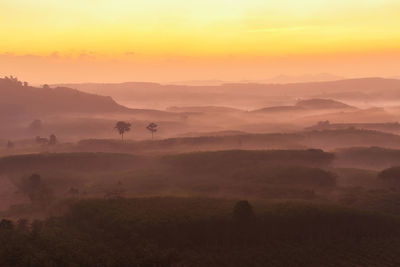 Scenic view of landscape against sky during sunset