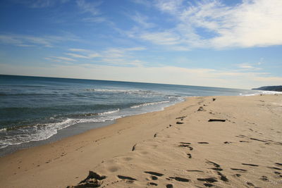 Scenic view of beach against sky