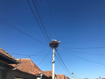 Low angle view of cables against sky