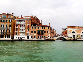 View of buildings against cloudy sky