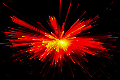 Abstract image of firework display against sky at night
