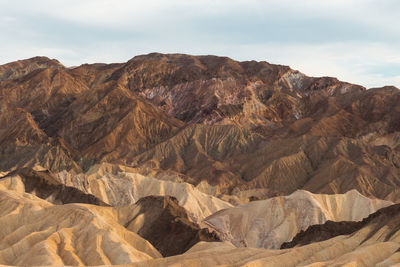 Rock formations in desert against sky