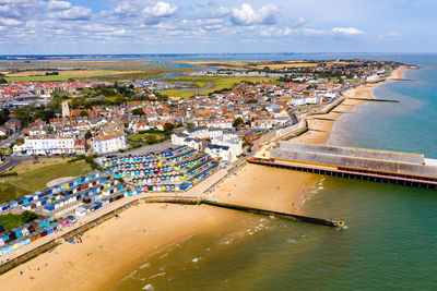 High angle view of townscape by sea against sky