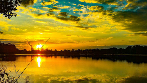 Scenic view of sea against orange sky