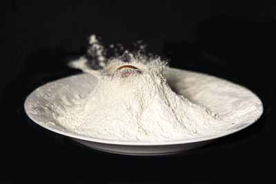 High angle view of bread on table against black background