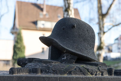 Close-up of statue against stone wall