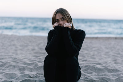 Woman looking at sea shore