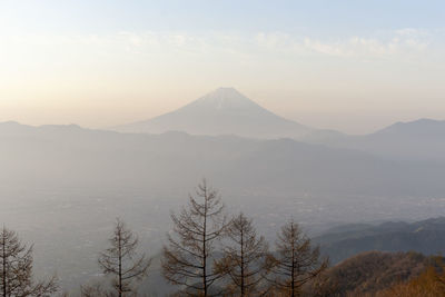 Scenic view of mountains against sky during winter