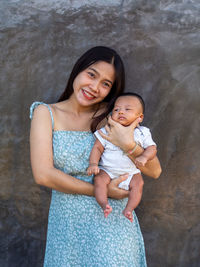 Woman and baby asian and nationality thai is happy feel
