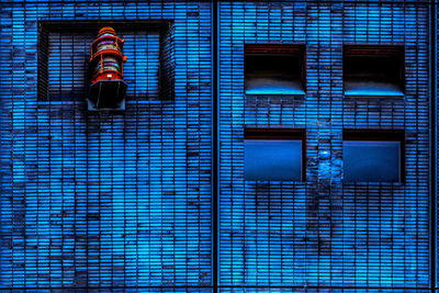 Low angle view of person against building