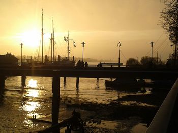 Scenic view of river at sunset