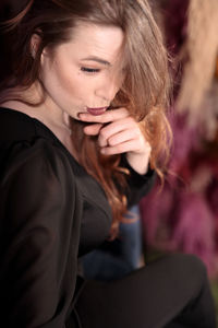 Portrait of young woman looking away